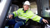 A Stena Aluminium employee smiling while working