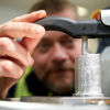 Close-up of a Stena Aluminium employee closely examining some material